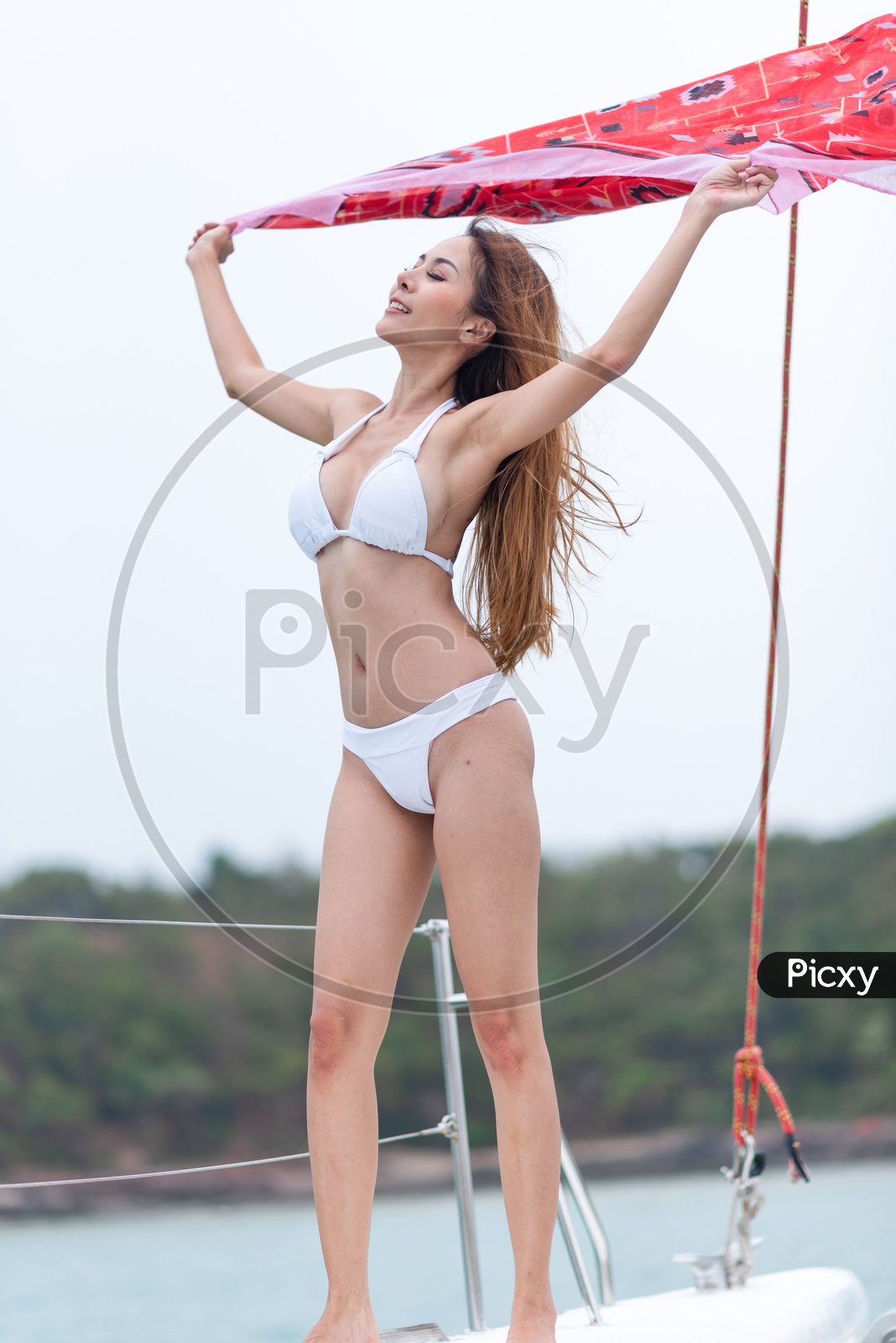 Asian Girl In White Bikini Enjoying Yacht Trip
