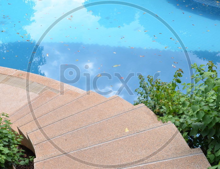 Staircase At a Swimming Pool With Blue Water
