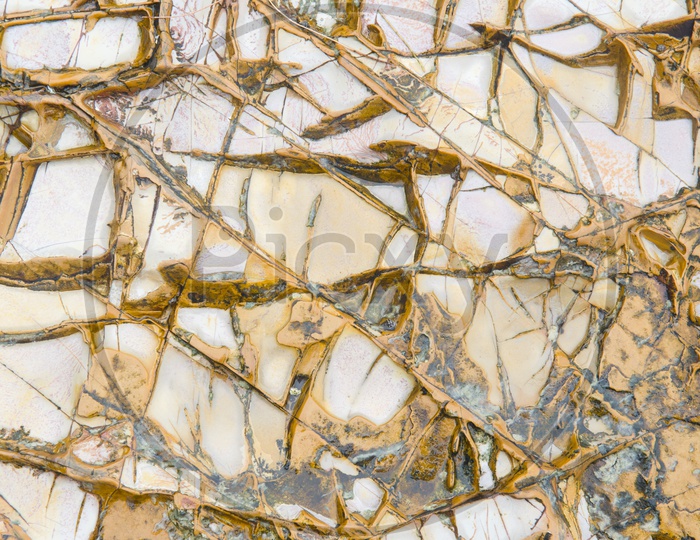 Brown Patterns By Oxidation Effect On Marble Stones Closeup Forming a background