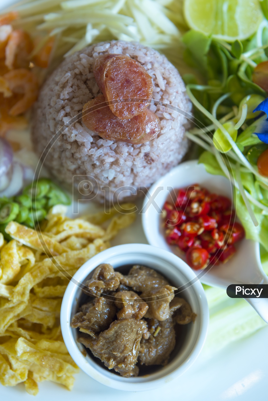 Thai Food, Rice Platter  With Pork, Shrimp or Prawn and Veggies Served Closeup
