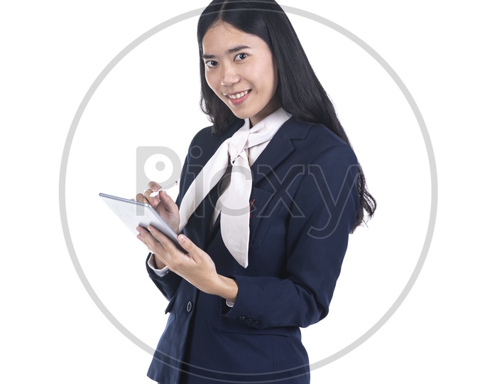business woman in a suit using a digital tablet And Posing With Smile Face on isolated background