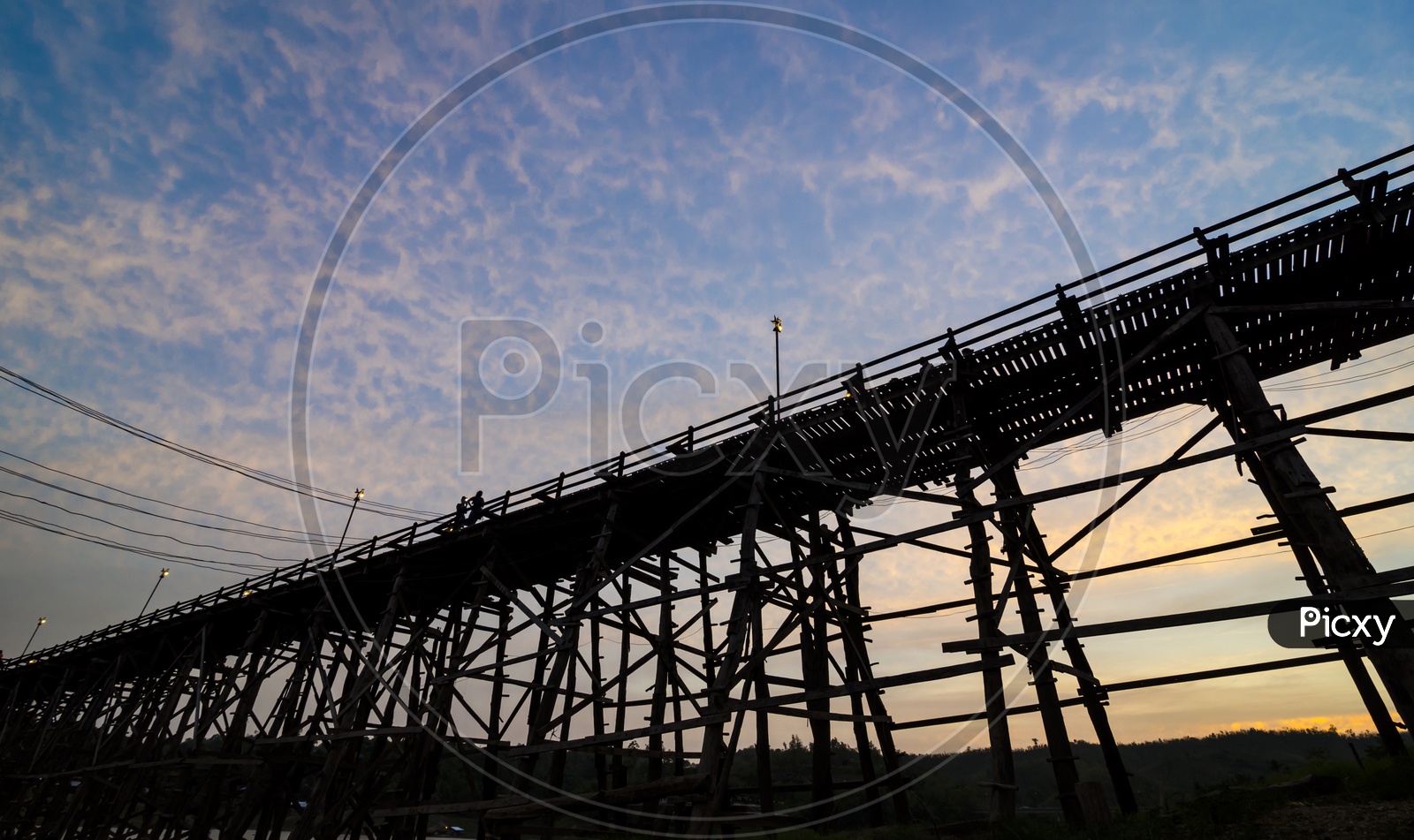 The longest wooden bridge With Sunset and floating Town in Sangklaburi Kanchanaburi Thailand