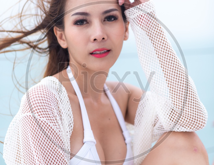 Asian Girl Wearing White Bikini And Posing