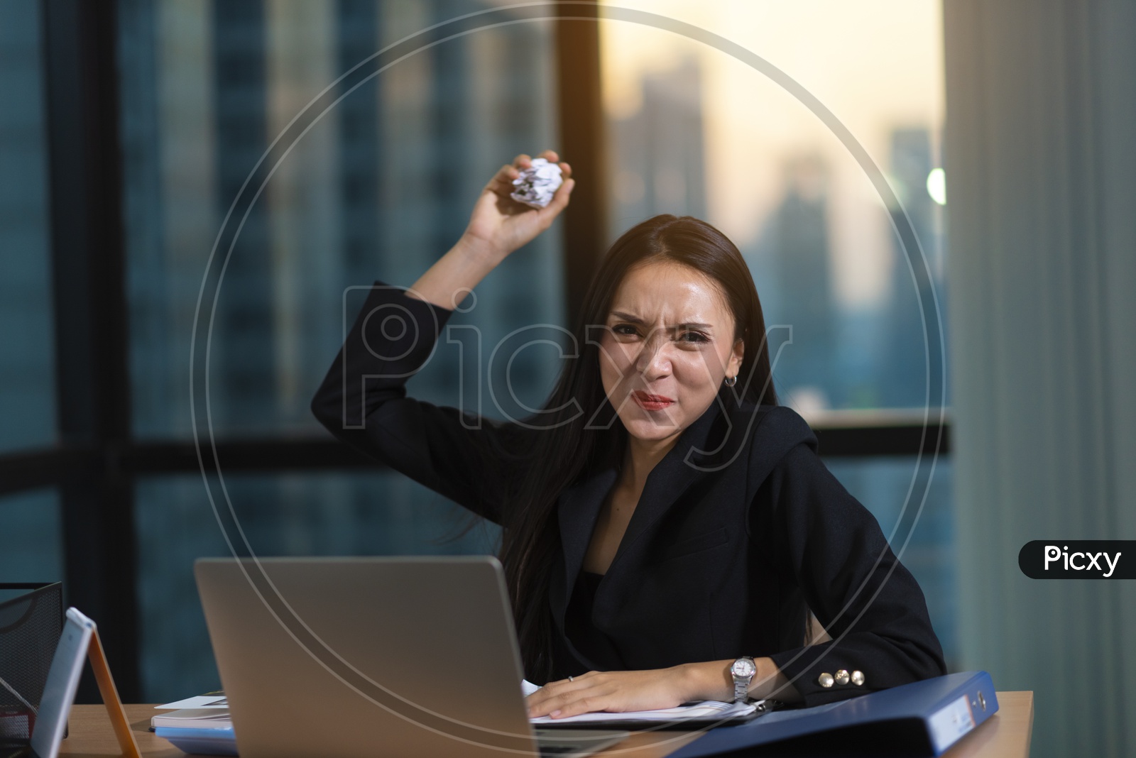 Frustrated Young Business Woman At Work Space Throwing Crushed Paper ball