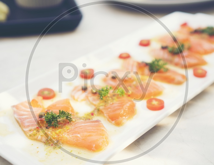 Sashimi Dish With Raw Salmon Fish Served in a Restaurant Table background