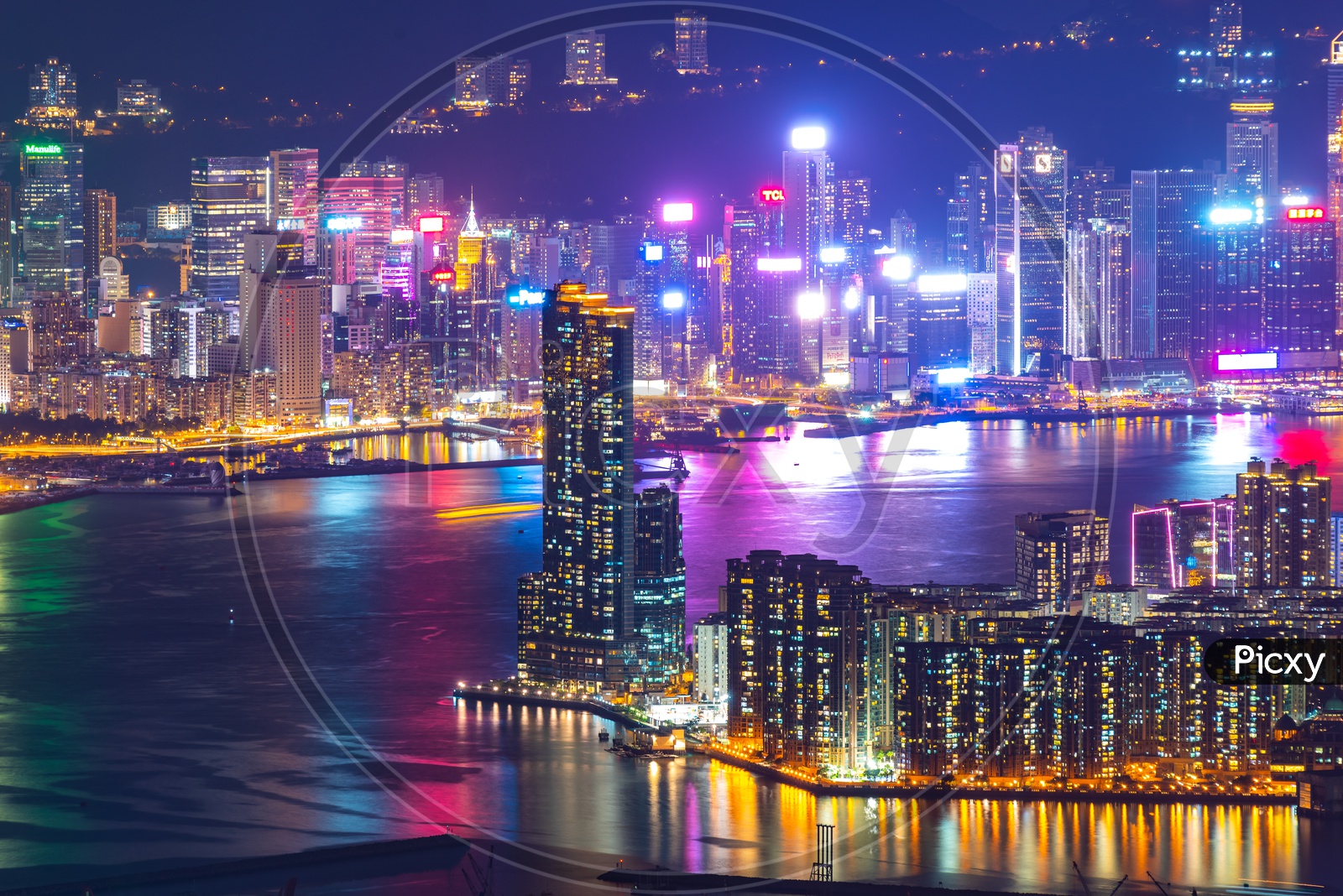 Night Scape of Hong Kong City With Building Lights and River Side