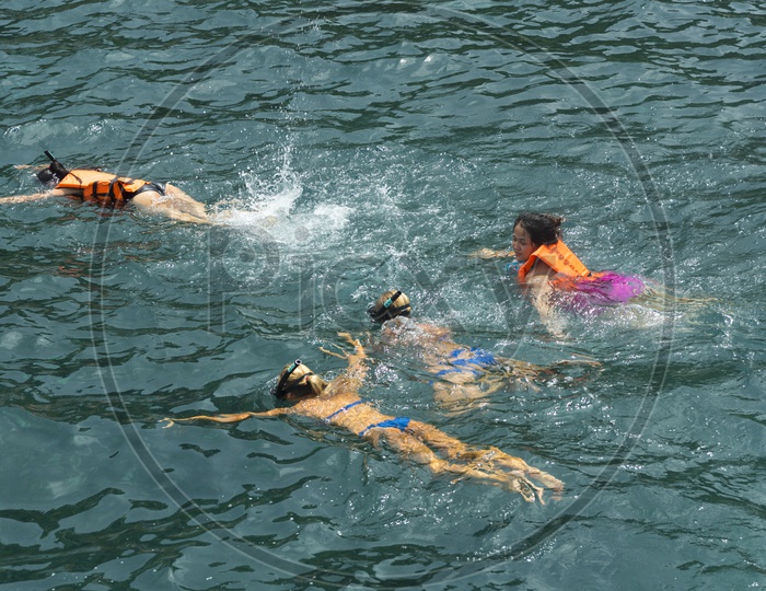 Tourist Woman Wearing Bikini And Swimming in Sea At Phuket
