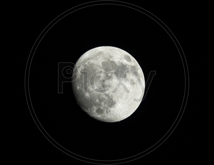 Bright Moon Over an Dark  Night Sky Background