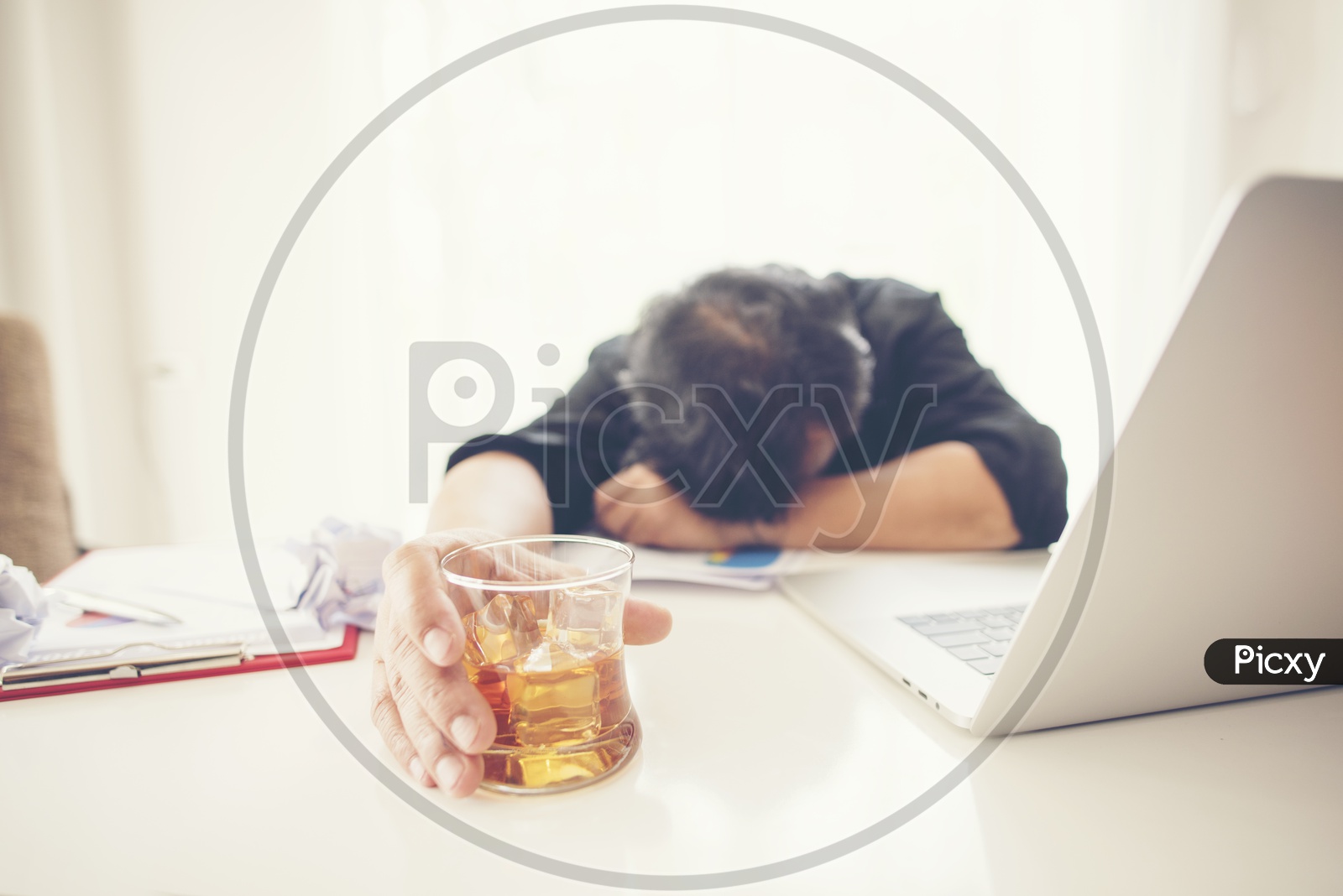 Depressed  Business Man Addicted to Alcohol With Alcohol Glass At Office Desk