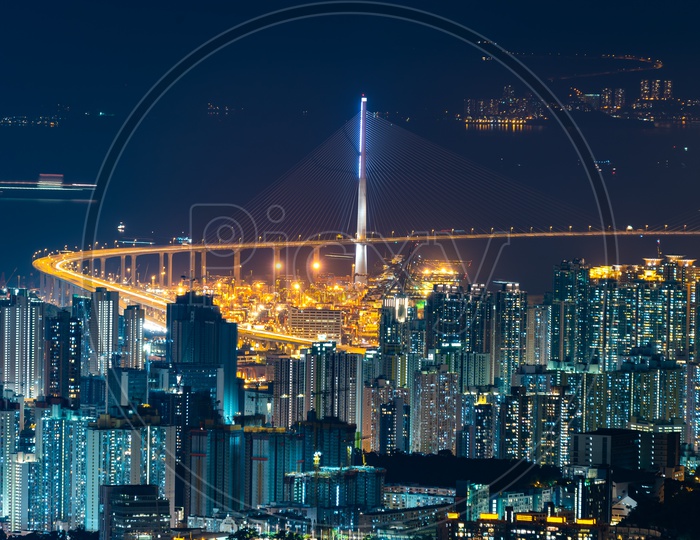 Hong Kong City Night Scape With Cable Suspension bridge over a River
