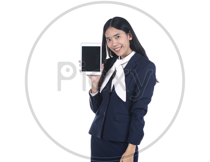 business woman in a suit using a digital tablet ipad on isolated background