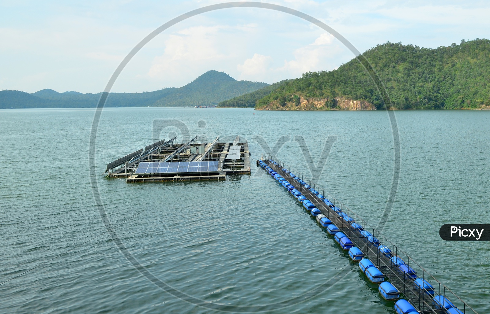Solar panels and buoy Lines on the water Surface  at a Hydroelectric power generation Plant