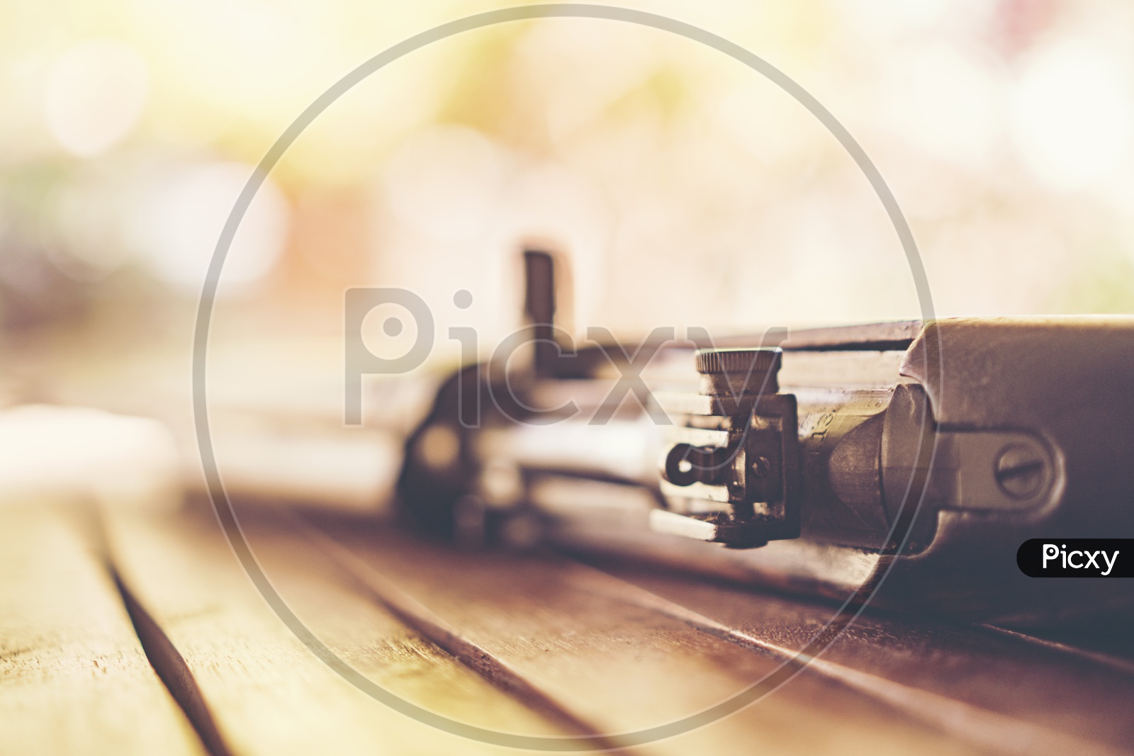 Ancient Machine Gun Used in World War II  On Wooden Background  With  Selective Focus