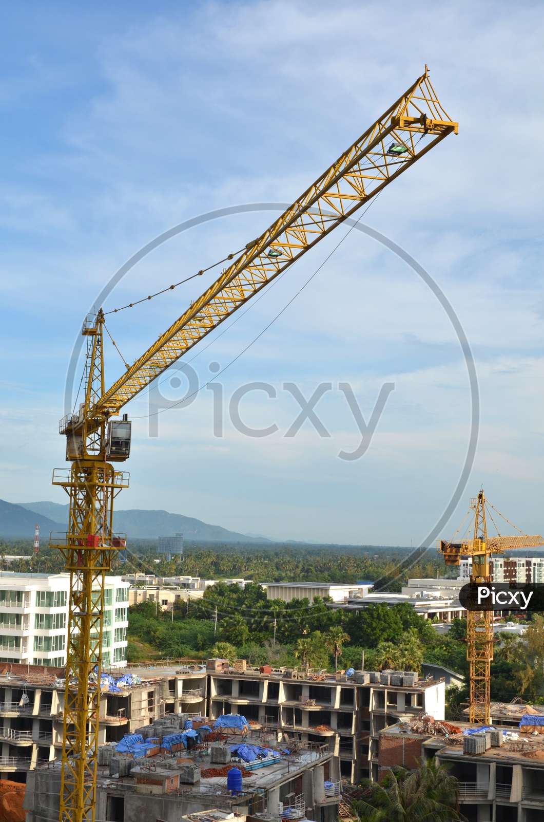 Cranes Working at Building Construction Sites