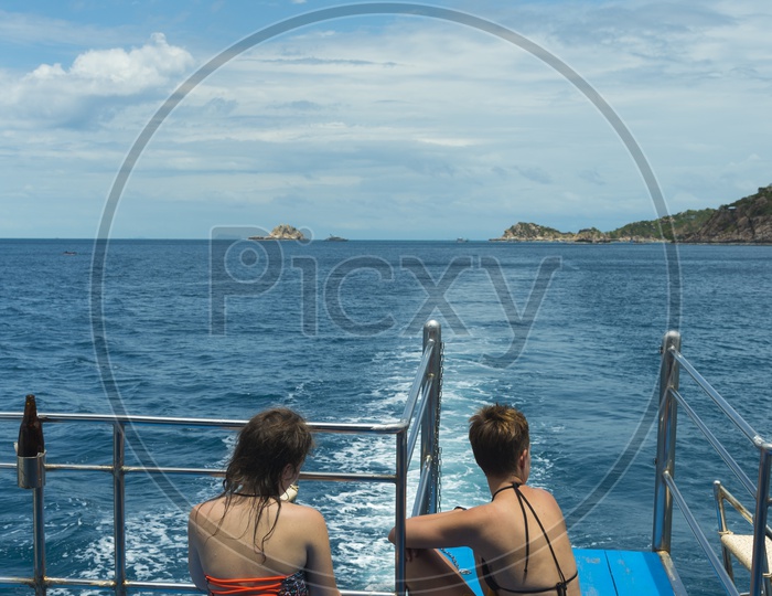 Young Woman Wearing Bikini And Enjoying The Yacht Rides in sea At  Phuket
