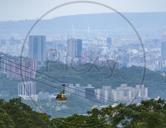 Rope Way or Cable Way With Cabin Cars With a View of City Scape