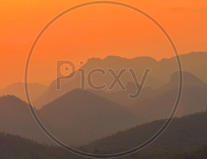 Mountains With Sunset Sky in background