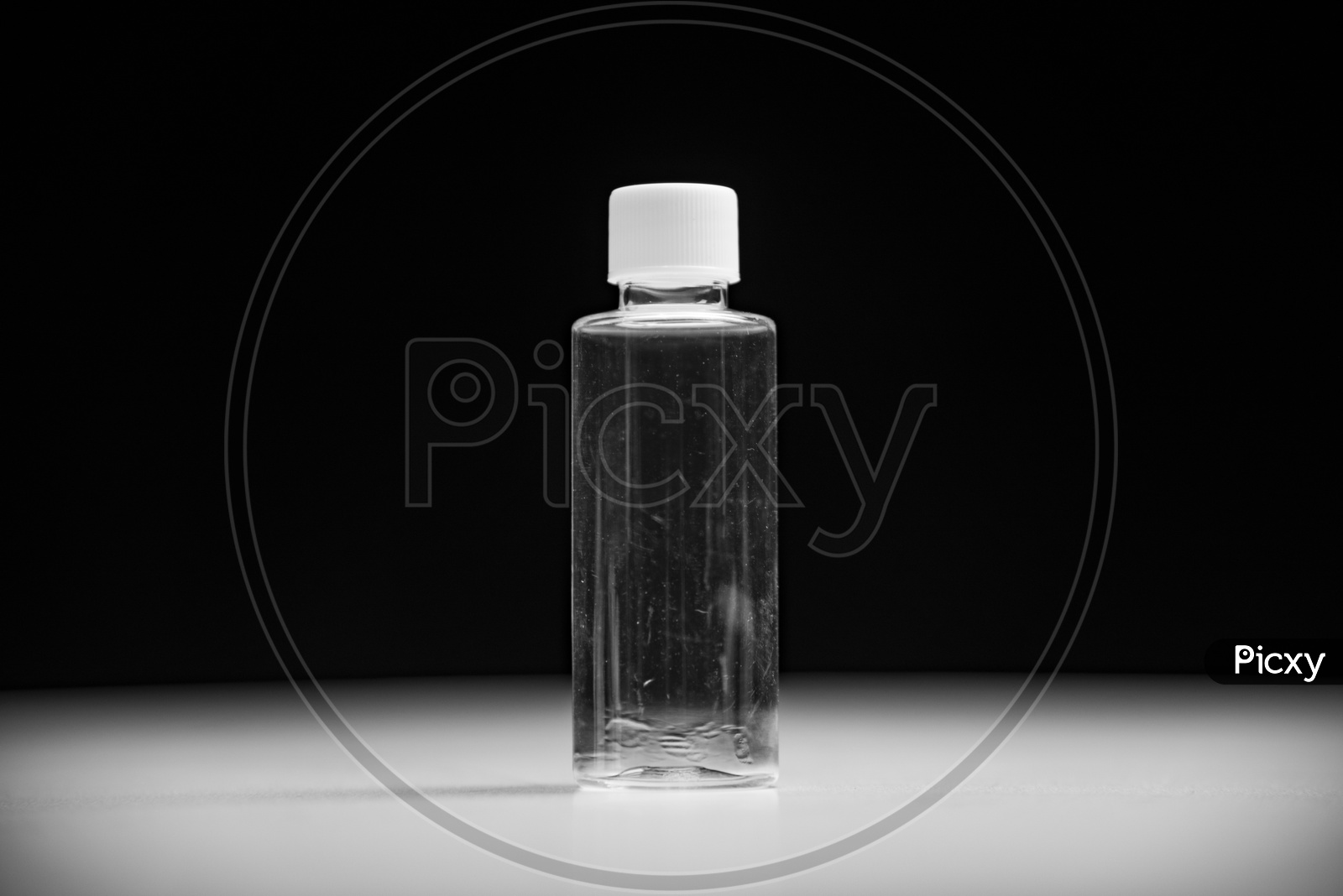 Empty cosmetic bottle container isolated on black background