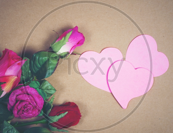 Flowers And Love Hearts On a Background