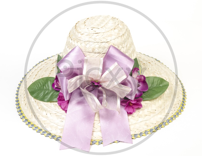 straw summer hat Decorated  with flowers on an isolated Background