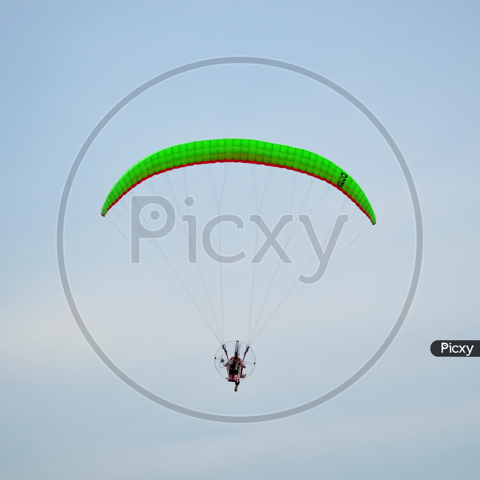 Moto paraglider Flying In Sky
