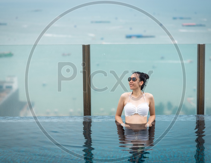 woman relaxing in swimming pool