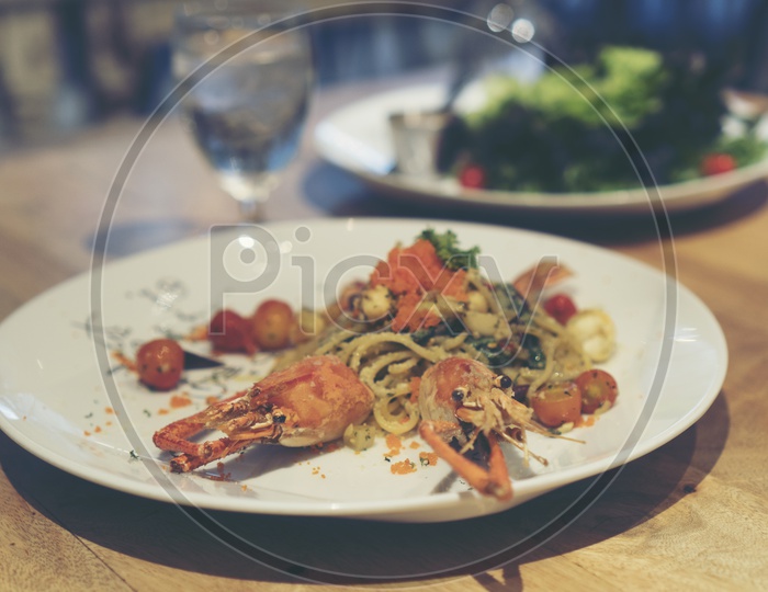 Spaghetti with shrimp and herbs Served In Restaurant