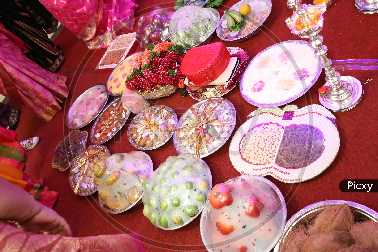 Sweets packed in plates for wedding. 