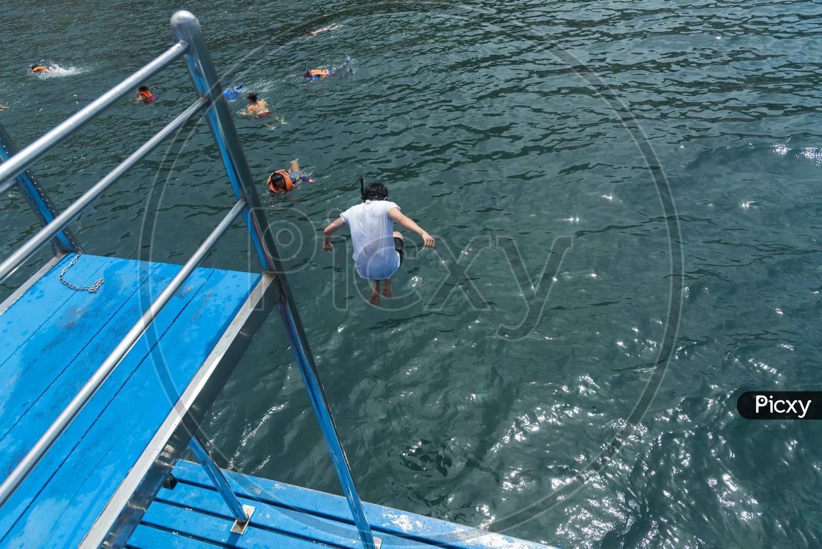 Tourists Jumping From Boats into Sea At Phuket Enjoying Swimming