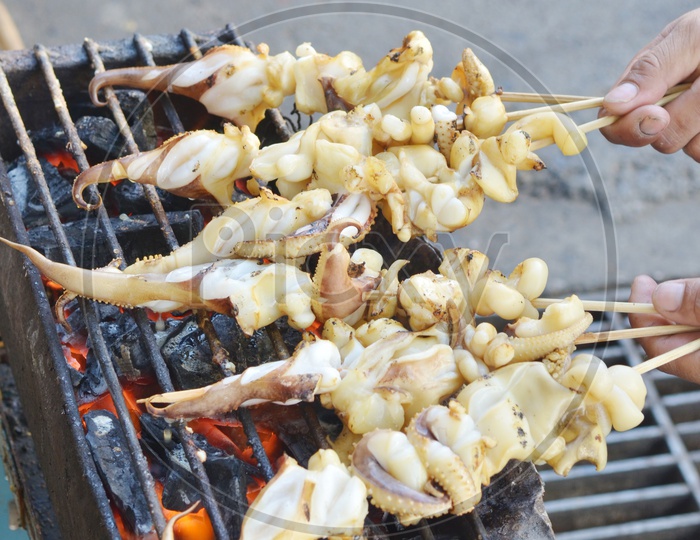 seafood barbecue of grilled squid on charcoal oven