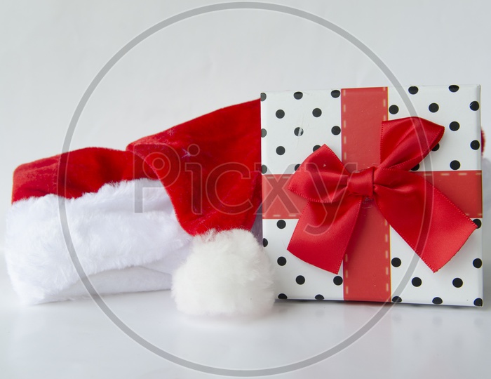 Santa Claus hat with Gift Box For Christmas On an Isolated White Background