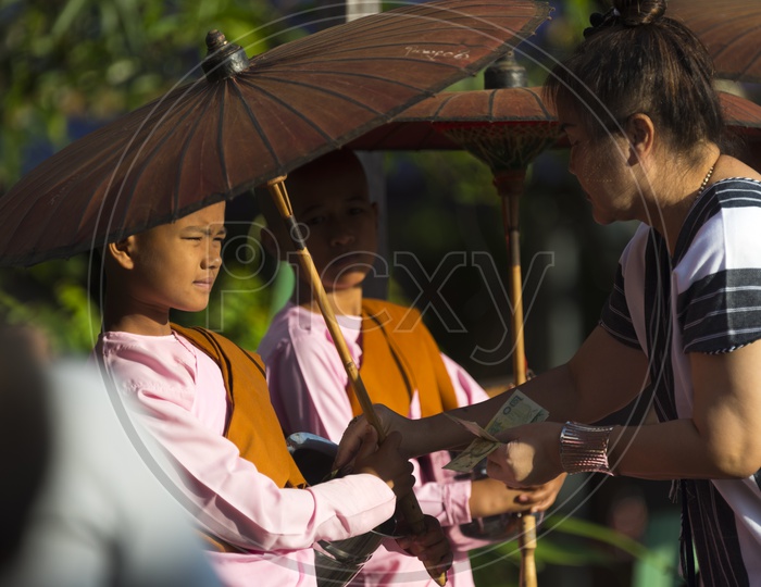 Buddhist Mon Students On Wooden bridge At Sangkhla Buri In Thailand