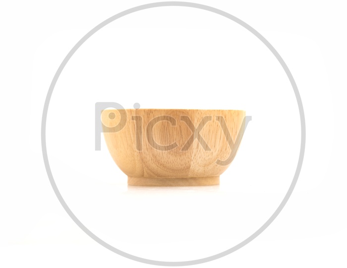 Bowls and utensils made of wood  isolated on white background