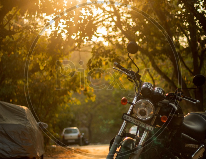 Royal Enfield Thunderbird in a street with sun flare