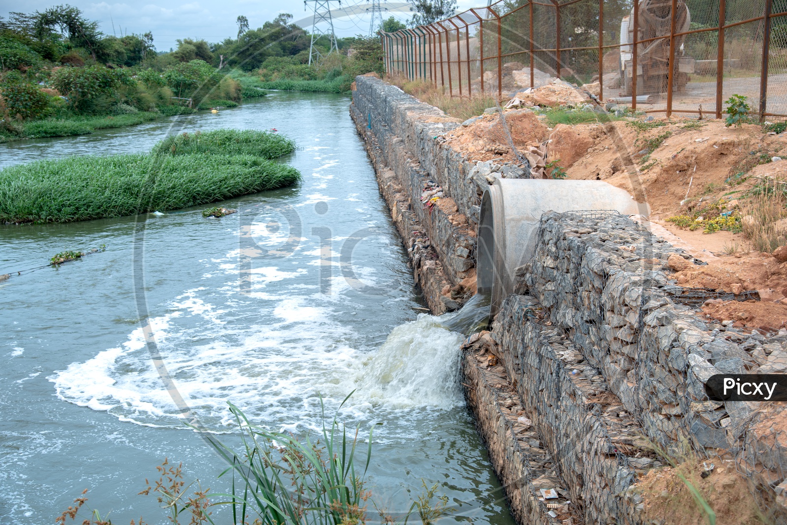 Sewage Water or Drain Water Flowing Into Canal Through Spun Pipes