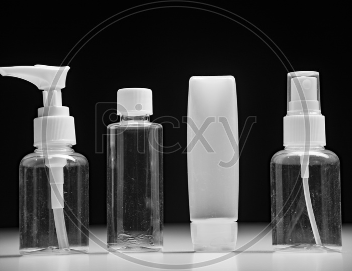 Empty bottle set for cosmetics with black background