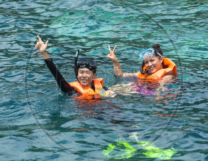 Tourists Woman Enjoying Deep Diving In Sea At Phuket