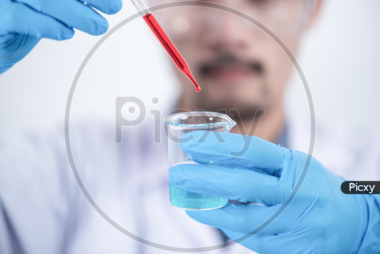 Asian Researcher with Safety gloves Dripping Blood into Glass Bottle Apparatus with Chemicals