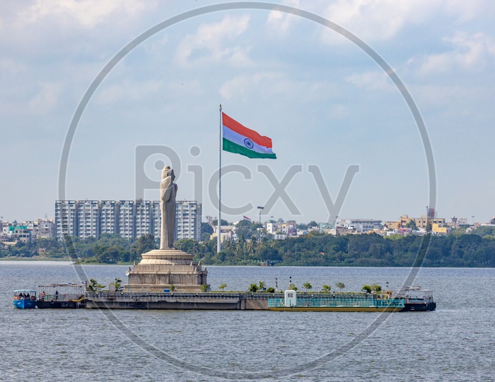 Monolith Of  Gautama Buddha Statue With Indian Flag in Background