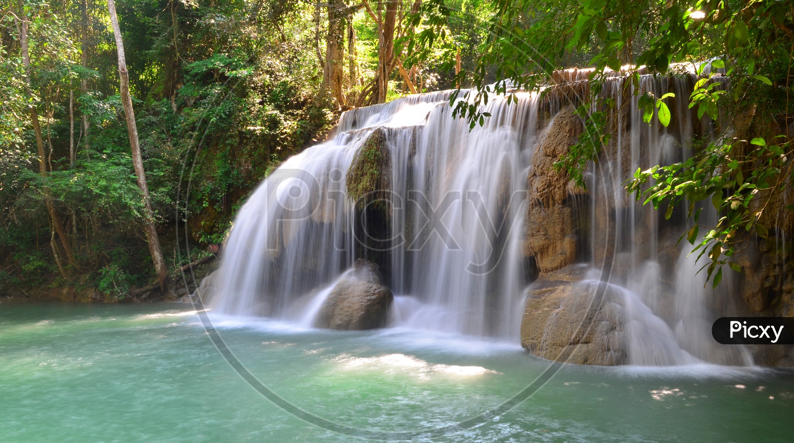 Waterfall into a lagoon at Erawan National Park Thailand