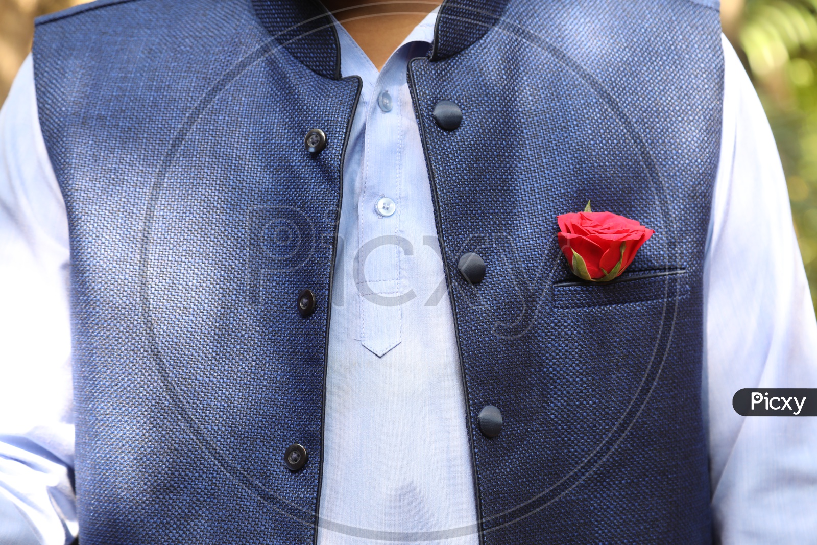 A Man wearing Rose in the Pocket Square