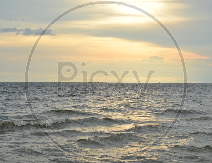 Beautiful Sunset Over Sea Water With Golden Hour Sky In background