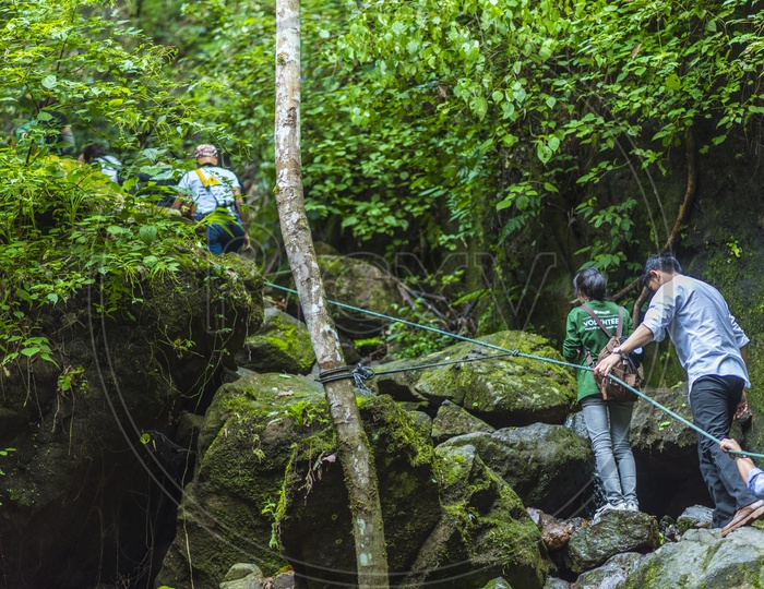 Adventure Travelers Trekking in Nature At Khao Yai National Park In Thailand