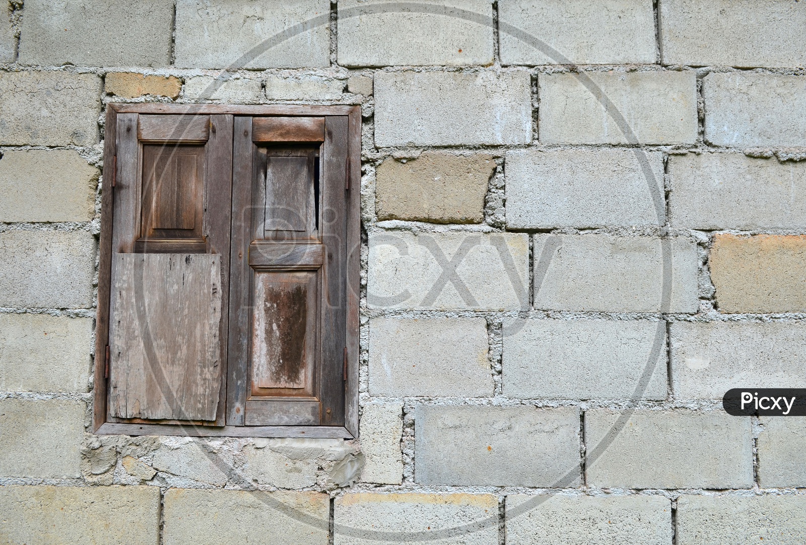 Old Brick Wall With traditional Wooden Window Forming a background