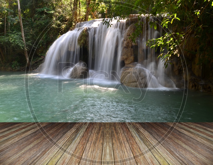 Water Falls in tropical Forest With Wooden Platform
