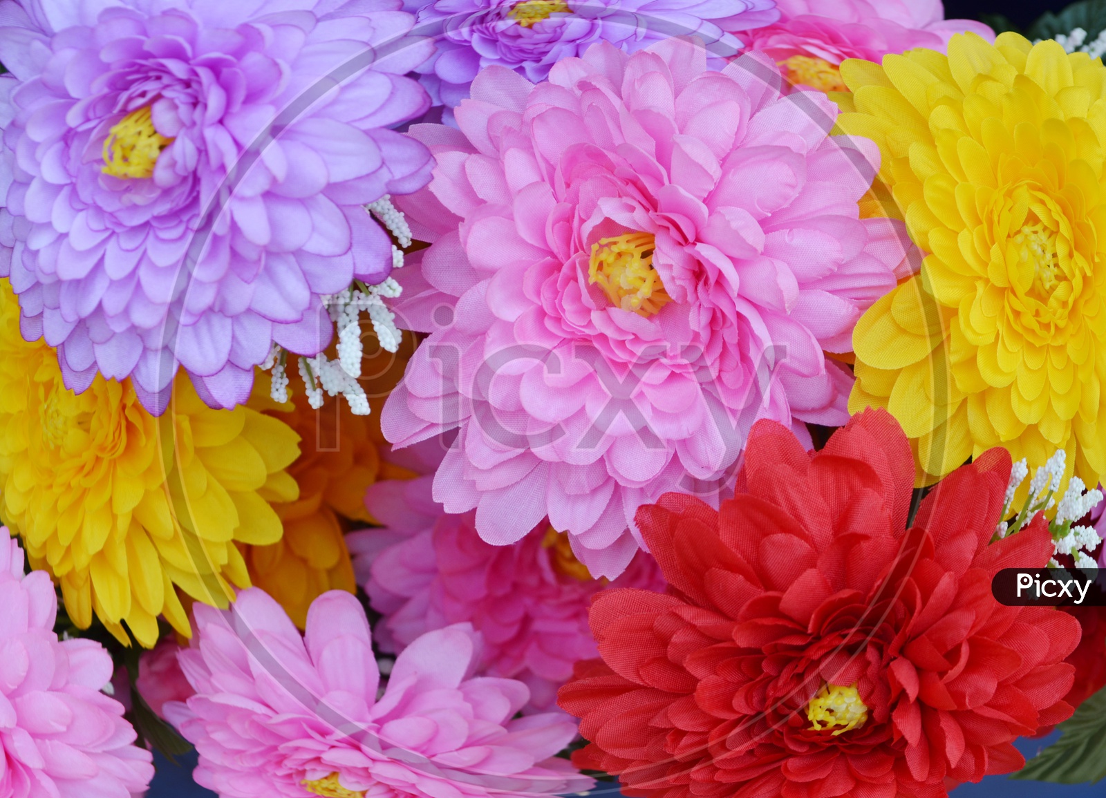 Colourful Artificial Flowers Filled Background