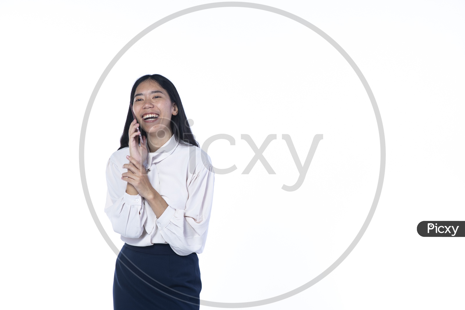 Young Business Woman Talking In Smartphone With Smile Face  over An Isolated White Background