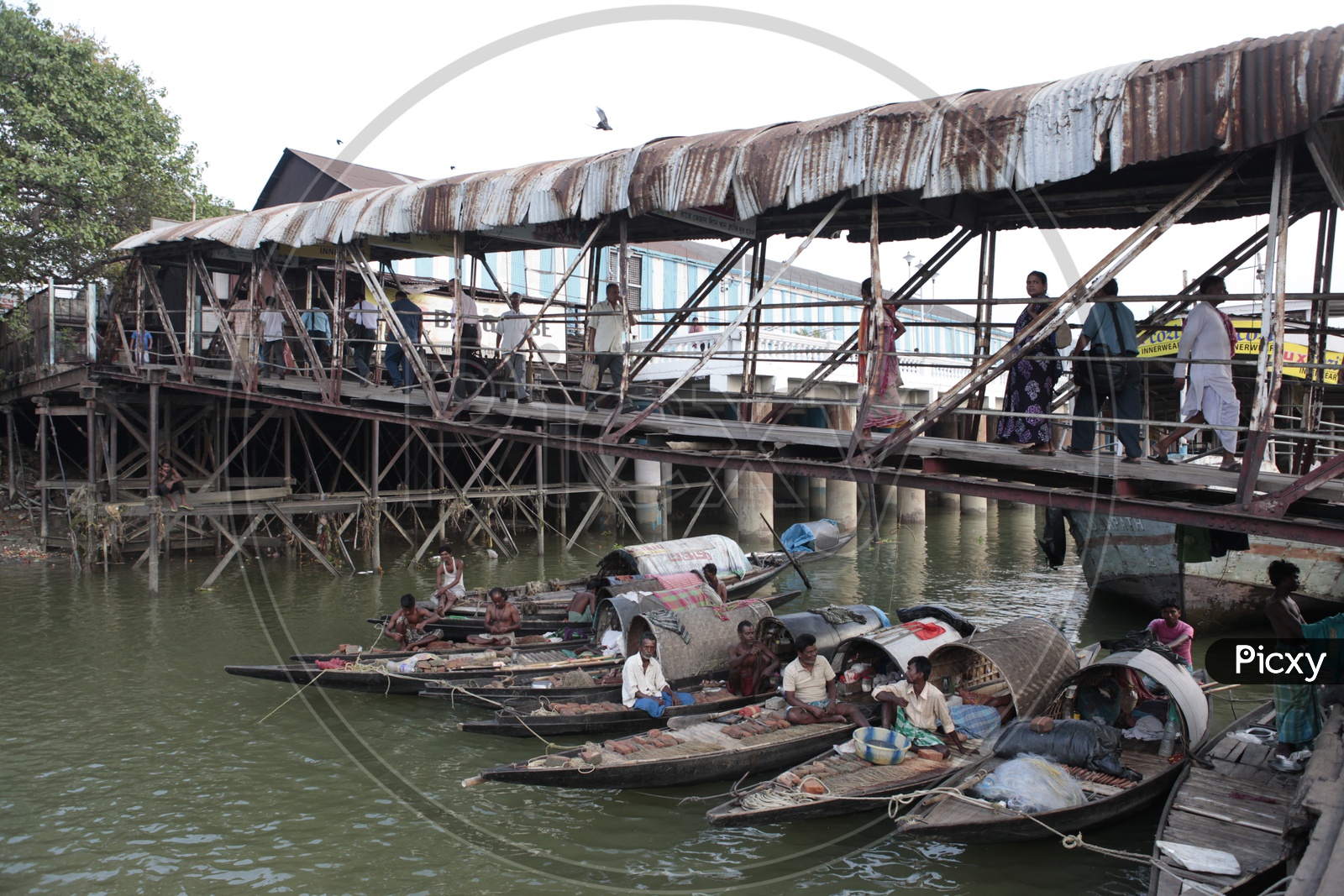 Fishermen with their Gondola boats alongside the Hooghly River