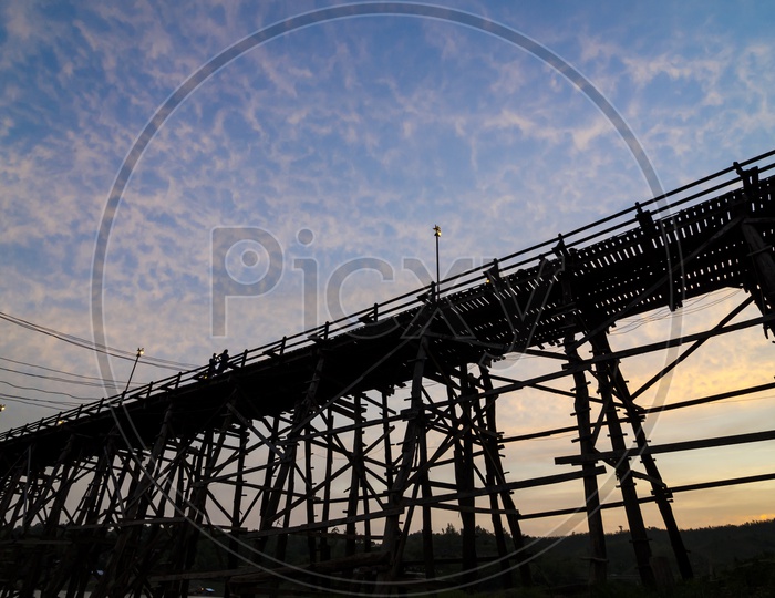 The longest wooden bridge With Sunset and floating Town in Sangklaburi Kanchanaburi Thailand