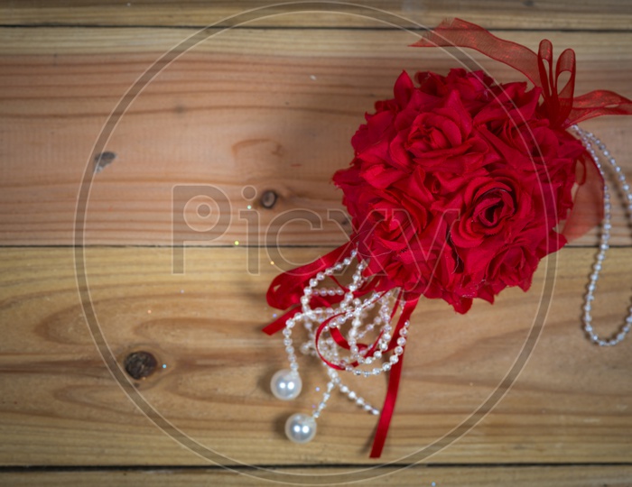 Artistic Background With Red Flowers And Pearls Chain With Spacing